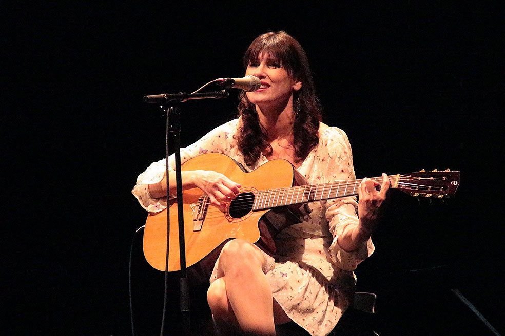 She performs one of her compositions in concert